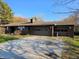 Spacious two-car garage with a brick facade, complemented by a wide driveway and a well-kept lawn at 935 Fry Rd, Greenwood, IN 46142