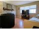 Cozy living room with a decorative brick fireplace, neutral walls, and wood laminate flooring at 935 Fry Rd, Greenwood, IN 46142