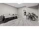 Finished basement with ping pong table and electronic drum set on neutral carpeting at 945 Baywood Ct, Columbus, IN 47201