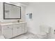 Bathroom with a vanity, neutral countertop and cabinets, toilet, and square mirror at 945 Baywood Ct, Columbus, IN 47201