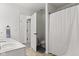 A bathroom with a tub and shower, a toilet, and a vanity with storage at 945 Baywood Ct, Columbus, IN 47201