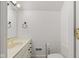 Bright bathroom with toilet, vanity, towel rack and gold faucet at 945 Baywood Ct, Columbus, IN 47201