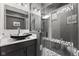 Contemporary bathroom featuring vessel sink, modern tile design, glass shower, and dark vanity at 945 Baywood Ct, Columbus, IN 47201