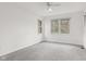 Spacious bedroom features soft carpet and double windows providing plenty of natural light at 945 Baywood Ct, Columbus, IN 47201