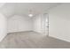 Large bonus room with neutral walls, plush carpeting, ceiling fans, and plenty of storage at 945 Baywood Ct, Columbus, IN 47201