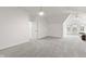 Open bonus room with neutral walls, plush carpet, ceiling fans and natural light at 945 Baywood Ct, Columbus, IN 47201