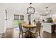 Open-concept dining area flows into the kitchen with wood floors and backyard access at 945 Baywood Ct, Columbus, IN 47201