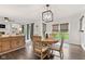 Sunlit dining room with hardwood floors, a stylish chandelier, and easy access to the backyard at 945 Baywood Ct, Columbus, IN 47201