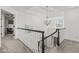 Upper foyer with high ceilings and a view of the chandelier and entrance at 945 Baywood Ct, Columbus, IN 47201