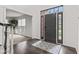 Inviting foyer with hardwood floors, stylish rug, and view into the living room at 945 Baywood Ct, Columbus, IN 47201