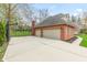 Spacious three car garage and extensive driveway, perfect for car enthusiasts and ample parking at 945 Baywood Ct, Columbus, IN 47201
