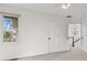 Hallway features soft carpet, a window, and access to the second story of the home at 945 Baywood Ct, Columbus, IN 47201