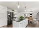 Bright kitchen features an island, stainless steel appliances, and seamless flow into the dining and living area at 945 Baywood Ct, Columbus, IN 47201