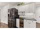 Contemporary kitchen featuring stainless steel appliances, a wine cooler, and stylish cabinetry at 945 Baywood Ct, Columbus, IN 47201