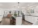 Open kitchen with a view to the living room, an island, and ample countertop space at 945 Baywood Ct, Columbus, IN 47201