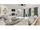 Relaxing living room featuring a fireplace, large sectional sofa, and natural light at 945 Baywood Ct, Columbus, IN 47201