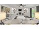 Cozy living room with a brick fireplace, built-in shelving, and comfortable seating at 945 Baywood Ct, Columbus, IN 47201