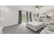 Bright living room with a gray sectional and french doors that lead to the backyard at 945 Baywood Ct, Columbus, IN 47201