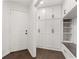Well-equipped mudroom with storage cabinets, a bench, and convenient access to the outdoors at 945 Baywood Ct, Columbus, IN 47201