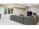 Basement area featuring a cozy sofa, TV area, and natural light from the window at 9838 Gulfstream Ct, Fishers, IN 46037