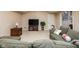 Basement area with a sofa, TV, and decorative items, creating a cozy space at 9838 Gulfstream Ct, Fishers, IN 46037