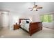 Well-lit bedroom with vaulted ceilings, light carpet, and a classic wood bed with end tables at 9838 Gulfstream Ct, Fishers, IN 46037