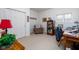 Bedroom with an armchair, closet, and desk offering comfort and functionality at 9838 Gulfstream Ct, Fishers, IN 46037