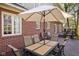 Outdoor dining on the expansive deck with seating, tables and large shade umbrella at 9838 Gulfstream Ct, Fishers, IN 46037