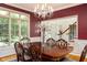 Formal dining room with a chandelier, large window, and classic decor at 9838 Gulfstream Ct, Fishers, IN 46037
