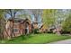 A beautiful brick home is shown with well kept lawn and professional landscaping on a lush lot at 9838 Gulfstream Ct, Fishers, IN 46037