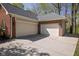Spacious three-car garage with a concrete driveway providing ample parking and storage space at 9838 Gulfstream Ct, Fishers, IN 46037
