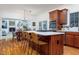 The kitchen features a stone countertop island with breakfast bar seating and stainless steel appliances at 9838 Gulfstream Ct, Fishers, IN 46037