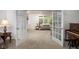 Open living room with French doors leading to backyard, flooded with natural light at 9838 Gulfstream Ct, Fishers, IN 46037