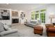 Inviting living room with built-in bookcases, fireplace, and comfortable seating at 9838 Gulfstream Ct, Fishers, IN 46037