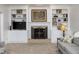 Living room featuring built in bookcases surrounding a fireplace with a TV at 9838 Gulfstream Ct, Fishers, IN 46037