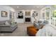 Spacious living room featuring built in bookcases, fireplace and French doors to backyard at 9838 Gulfstream Ct, Fishers, IN 46037