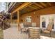 Charming outdoor patio with brick pavers, comfortable seating, and stairs leading to an upper level at 9838 Gulfstream Ct, Fishers, IN 46037