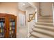 Staircase with carpeted steps leading to the upper level of the home at 9838 Gulfstream Ct, Fishers, IN 46037