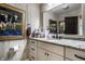 Bathroom featuring granite countertop vanity with framed mirror at 10605 Winterwood, Carmel, IN 46032