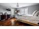 Spacious bedroom features hardwood floors, recessed lighting, with sitting area near bright windows at 10605 Winterwood, Carmel, IN 46032