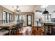 Dining room featuring a table with seating, chandelier, and view of the bright eat-in kitchen at 10605 Winterwood, Carmel, IN 46032