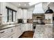 Stylish kitchen features granite counters, stainless appliances, and abundant natural light at 10605 Winterwood, Carmel, IN 46032