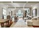 Bright living room with vaulted ceilings, large windows, fireplace, and hardwood floors at 10605 Winterwood, Carmel, IN 46032