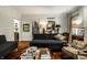 Sophisticated living room featuring hardwood floors, custom built-ins, and neutral decor at 10605 Winterwood, Carmel, IN 46032