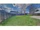 Spacious backyard is fenced and features a grassy area and patio at 10689 Brooks St, Indianapolis, IN 46234