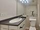 Well-lit bathroom features a large mirror, vanity and toilet area at 10689 Brooks St, Indianapolis, IN 46234