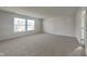 Spacious bedroom with neutral carpeting and abundant natural light at 10689 Brooks St, Indianapolis, IN 46234