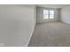 Clean bedroom with ample carpet and view of the backyard at 10689 Brooks St, Indianapolis, IN 46234