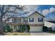 Traditional two-story home featuring green shutters, brick accents, and a well-maintained lawn at 10689 Brooks St, Indianapolis, IN 46234