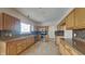 Well-equipped kitchen with stainless steel appliances, granite countertops, and tile backsplash at 10689 Brooks St, Indianapolis, IN 46234